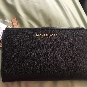 Brand New Michael Kors phone holding wristlet.